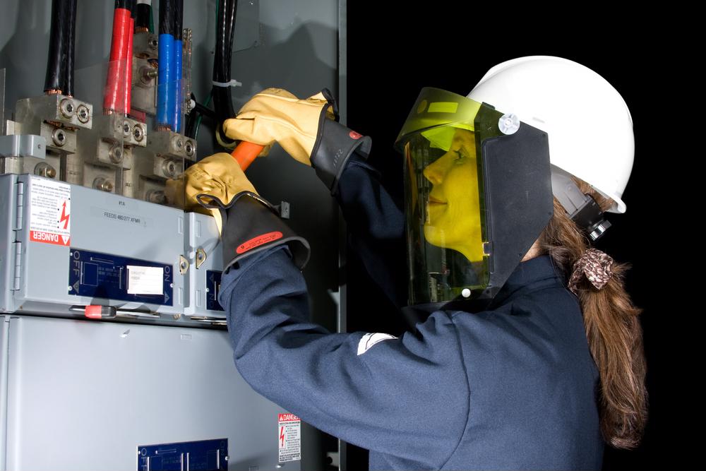 woman working on electrical equipment